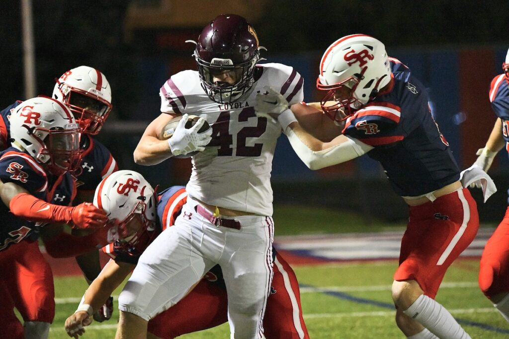 Mount Carmel handles St. Rita, remains undefeated in rivalry game